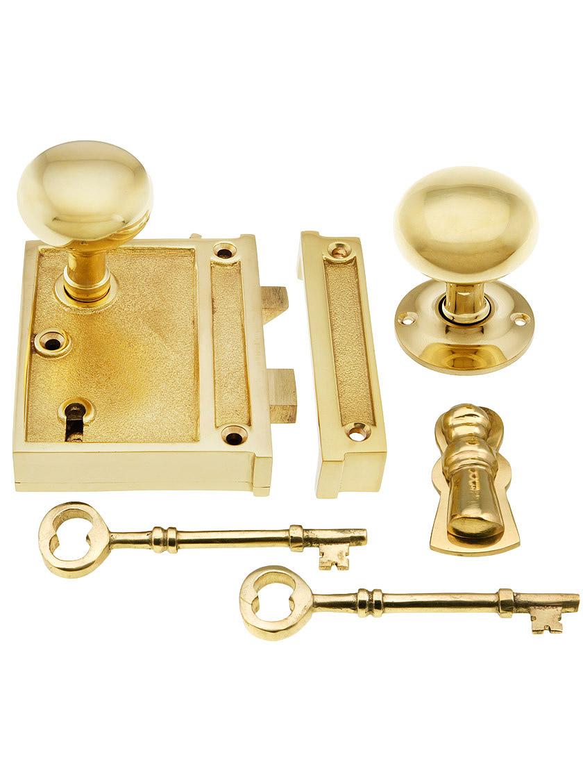 Solid Brass Vertical Rim Lock Set with Small Round Knobs.